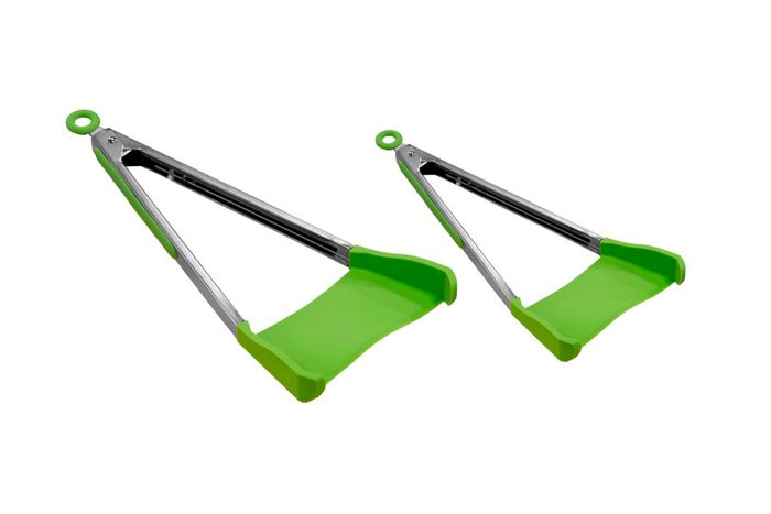 Two green, stainless steel-lifting tongs with flat, wide ends are positioned side by side on a plain white background.
