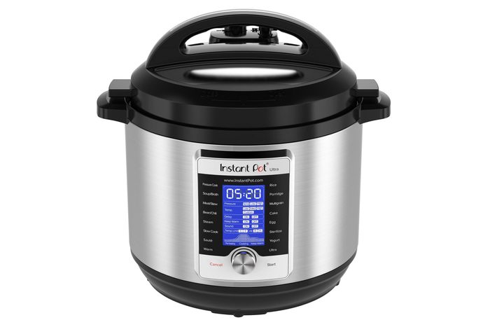 Silver Instant Pot displays cooking options and a digital timer, set against a plain white background.