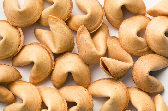 a lot of fortune cookies on wooden table