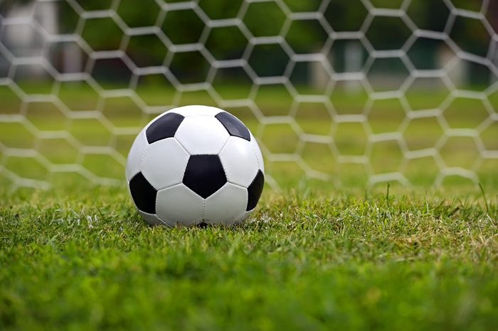 Leather soccer ball on a football stadium
