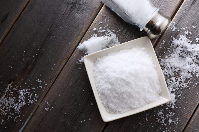 salt shaker on wooden table