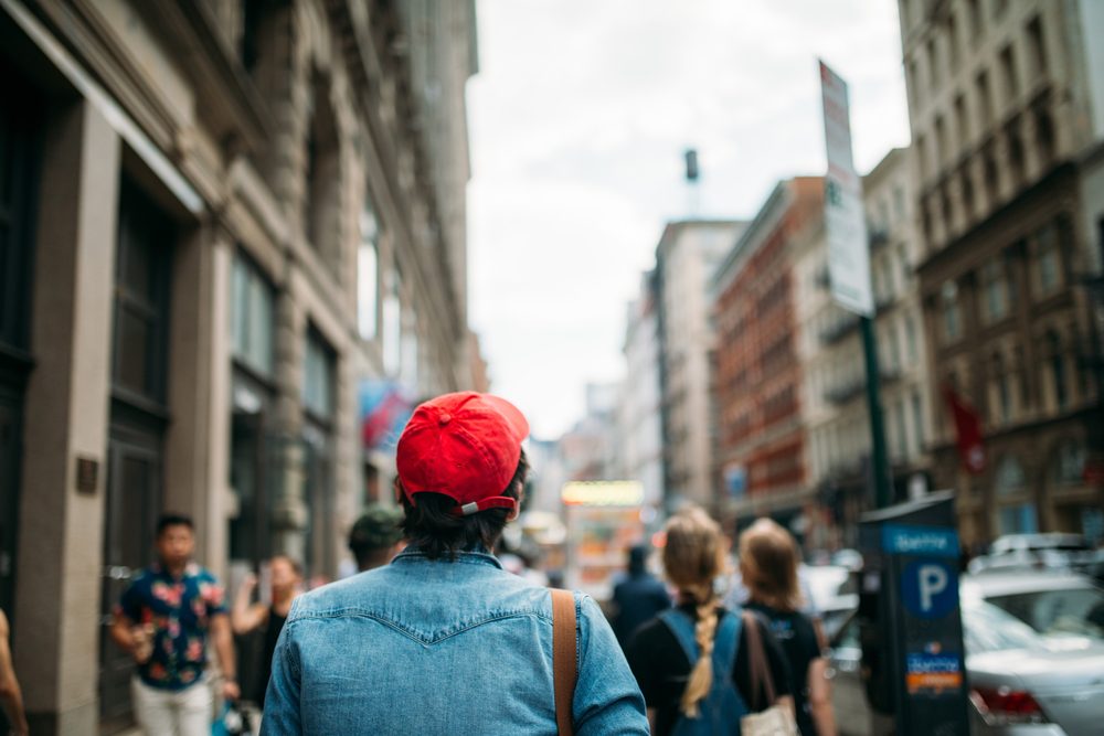 Man in red hat exploring the city