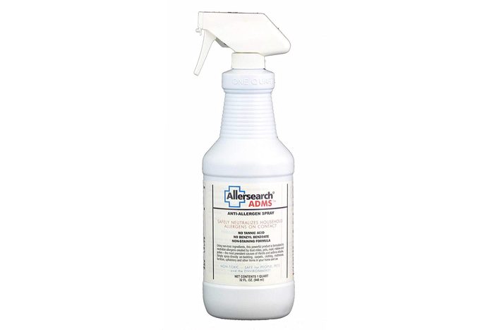 Spray bottle labeled Allersearch ADMS Anti-Allergen Spray stands upright, designed to neutralize household allergens. Text emphasizes safe, non-toxic formula. White background.
