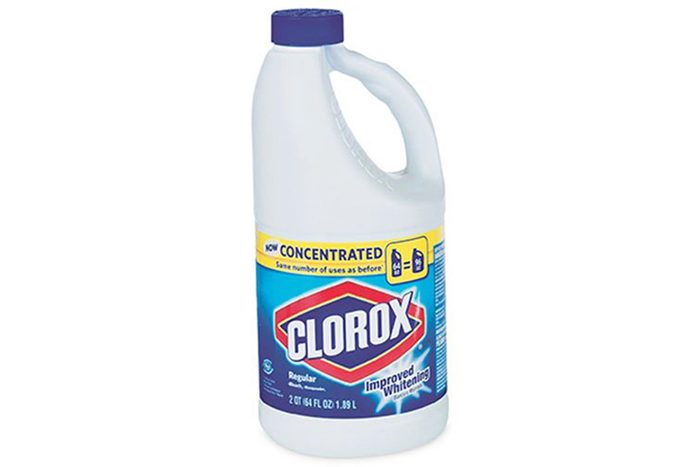 A plastic bottle with a blue cap displays 