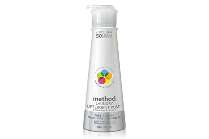 Detergent pump stands upright, displaying label with colorful logo and text: 