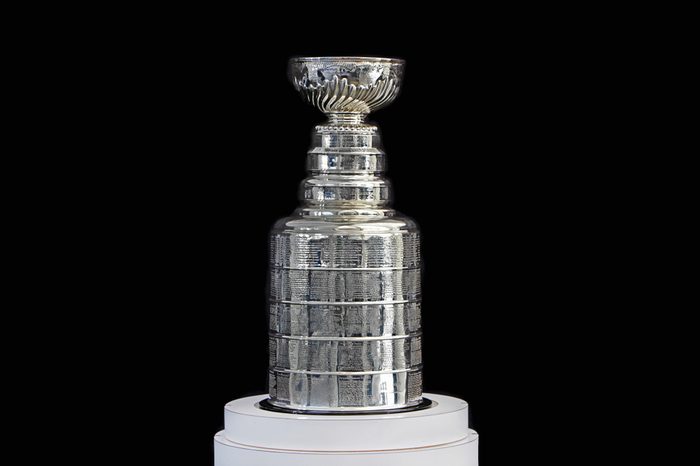 NHL ceremony - Stanley Cup trophy on the white stand, black background, Vancouver BC - October 22, 2018