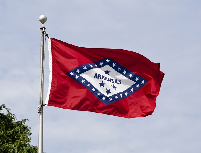 The Arkansas State Flag flying in the wind