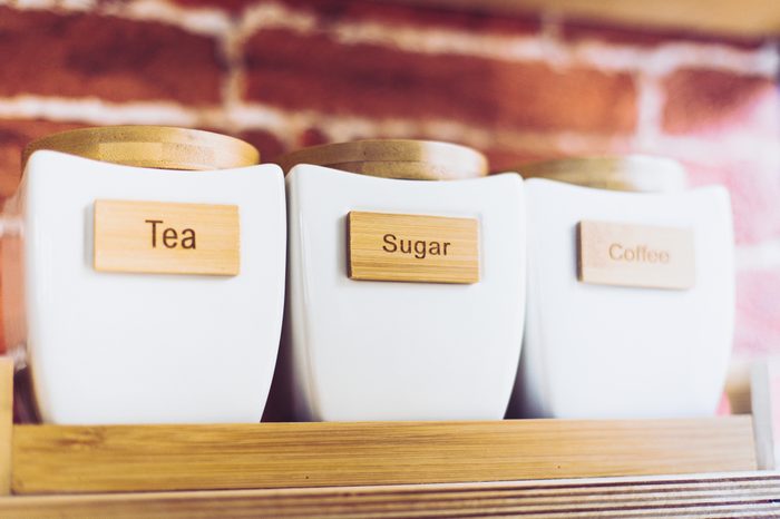 Modern white tea sugar coffee canisters set of three. Ceramic containers.