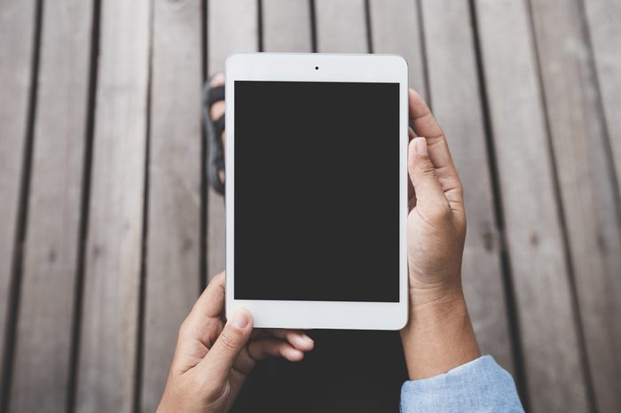 close-up person hold digital tablet blank screen