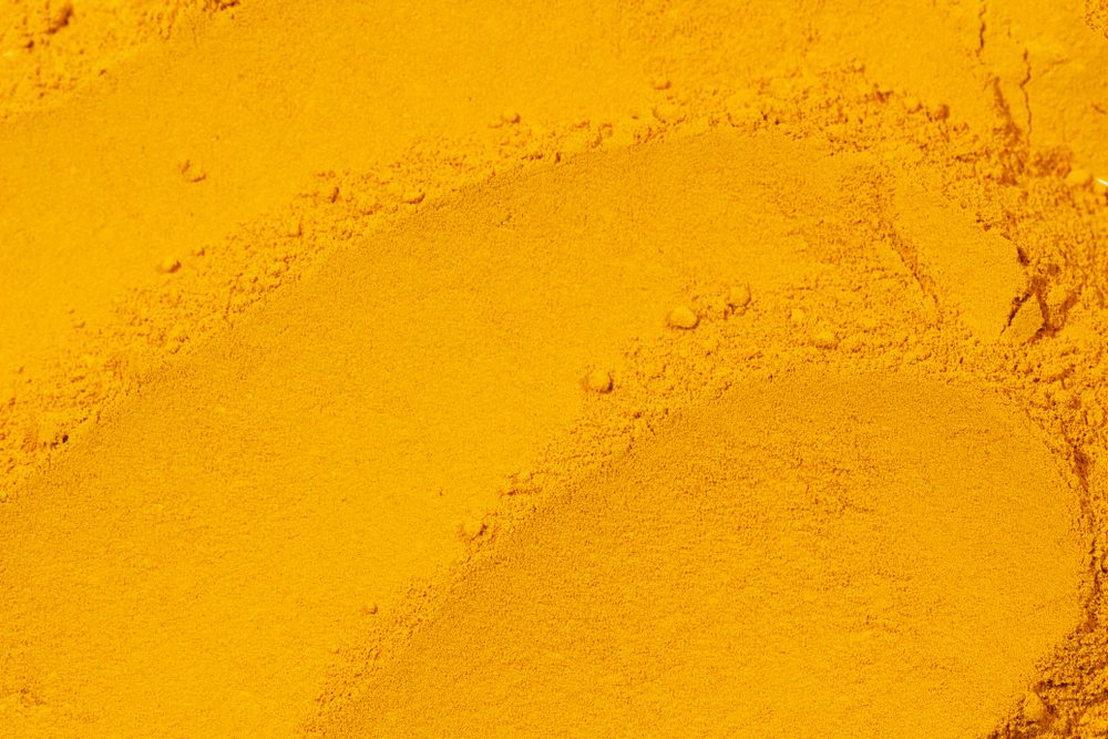 Close up turmeric powder texture,