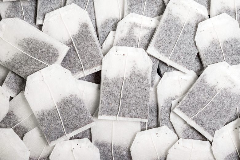 Close-up, a bunch of tea bags lie chaotically.