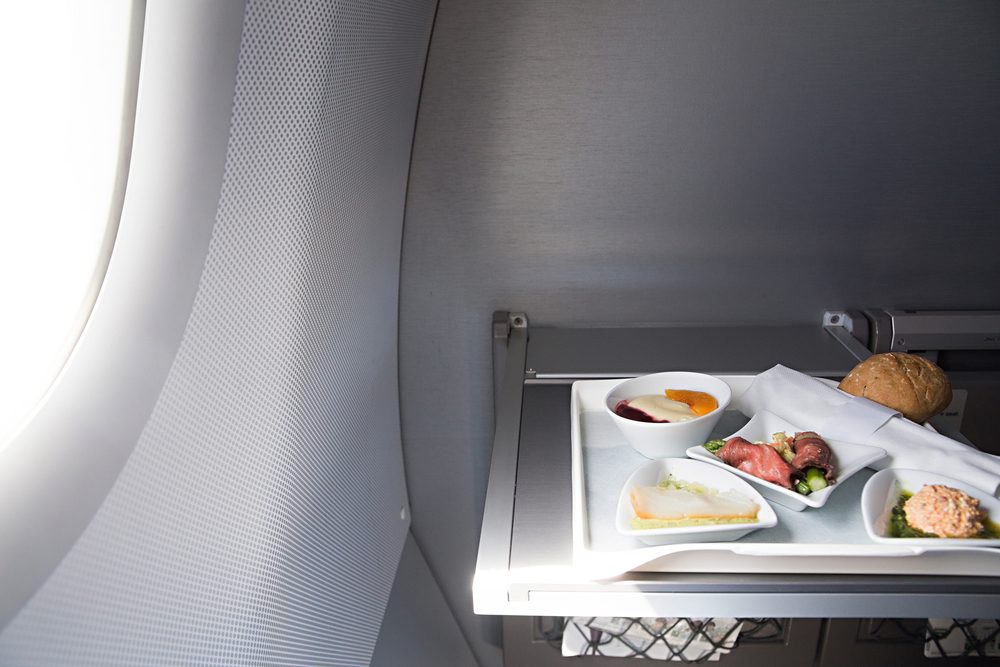 photo of Food served on board of business class airplane on the table