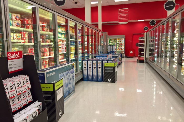 LAKEWOOD, CO - NOVEMBER 23, 2017: Television sets juxtapose grocery aisles at Target on Thanksgiving during Black Friday sales. Crowds are thinner due to sales dates spread across the entire weekend.