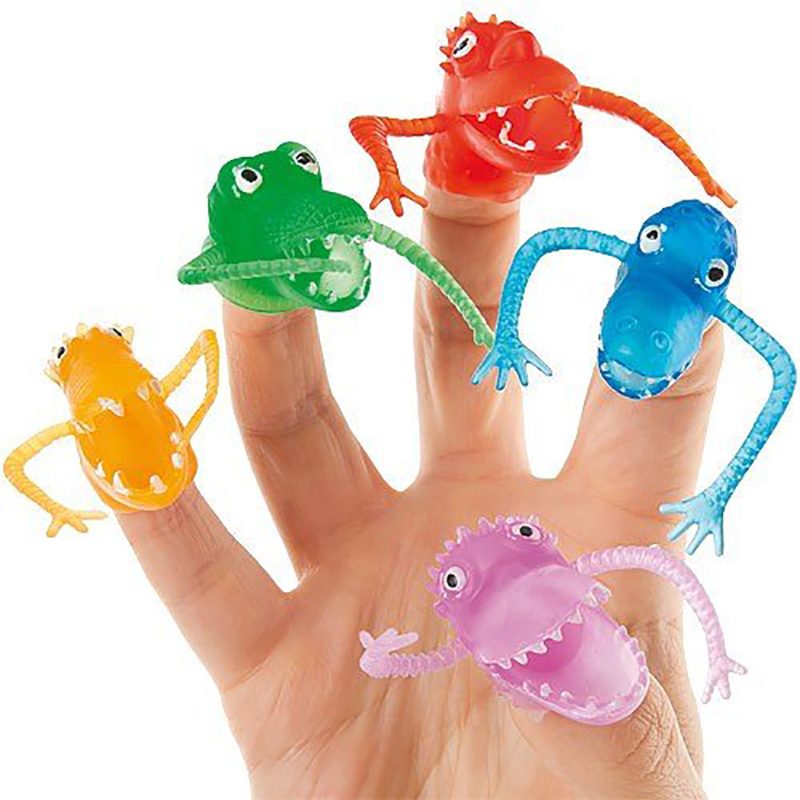Colorful plastic finger puppets, shaped like quirky monsters, adorn a hand, each character displaying playful expressions and outstretched arms in a whimsical setting.