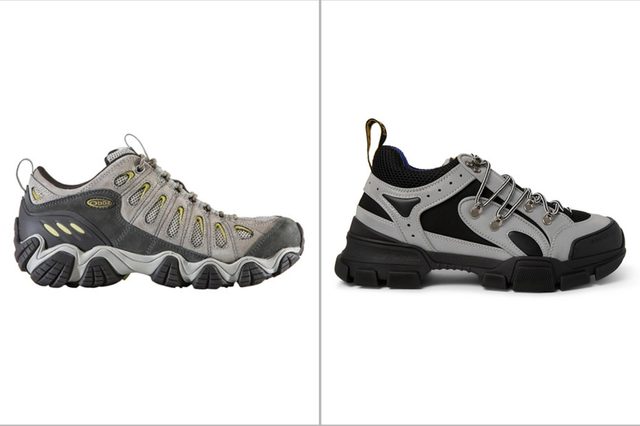 Two hiking shoes are side by side; the left one is gray with mesh, the right is black and gray with metal eyelets.