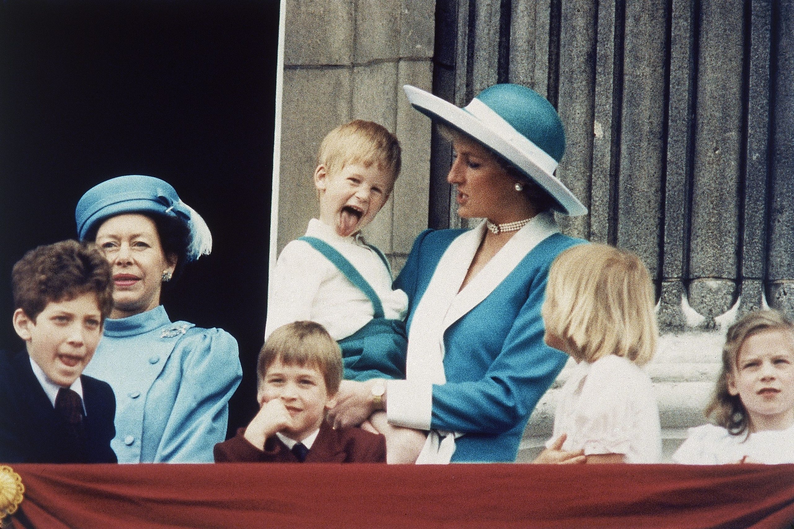 Britain's Prince Harry sticks out his tongue for the cameras on the balcony of Buckingham Palace