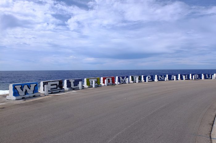 Welcome to Nauru sign on concrete barriers