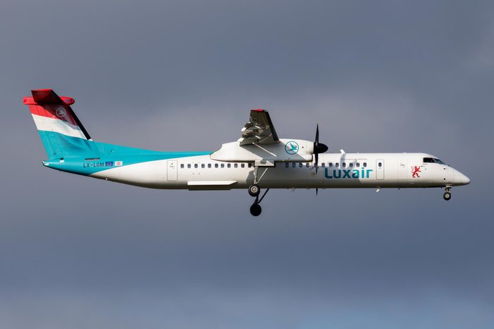 VIENNA / AUSTRIA - APRIL 6, 2018: Luxair Bombardier DHC-8 Q400 LX-LGM passenger plane landing at Vienna International Airport