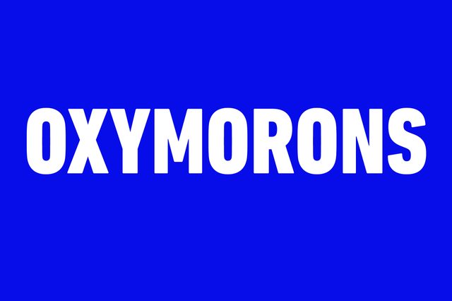 Text "OXYMORONS" displayed in bold white letters against a solid blue background.