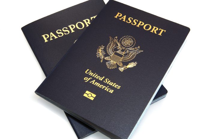 United States dark blue Passports arranged on an isolated white background