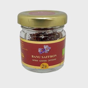 Jar contains saffron, sealed with a gold lid. Label reads 