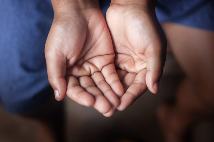 Two beggar hands palms up
