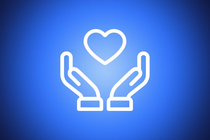 icon of two hands around a heart shape on blue background