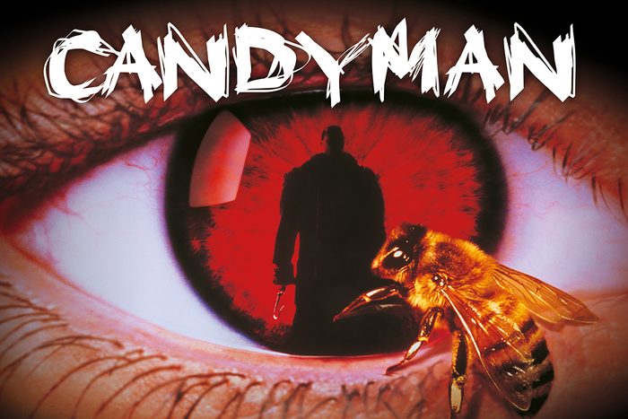 Bee crawling on a human eye; shadowy figure reflected in the pupil. Large text reads 