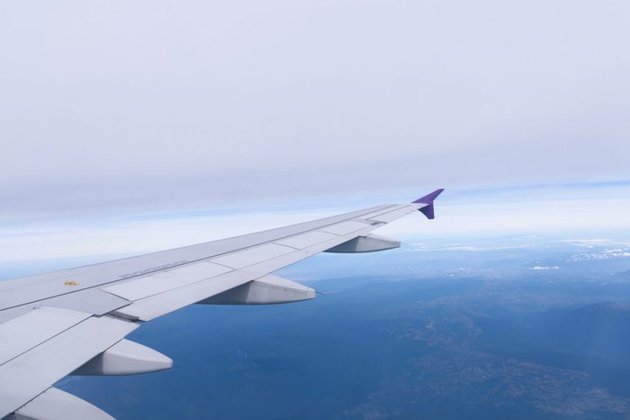View from window airplane with blue sky and earth land.Bird eye view.