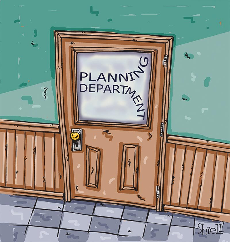 Wooden door labeled "Planning Department" with text misaligned. The door stands slightly ajar in a tiled hallway with a green wall.