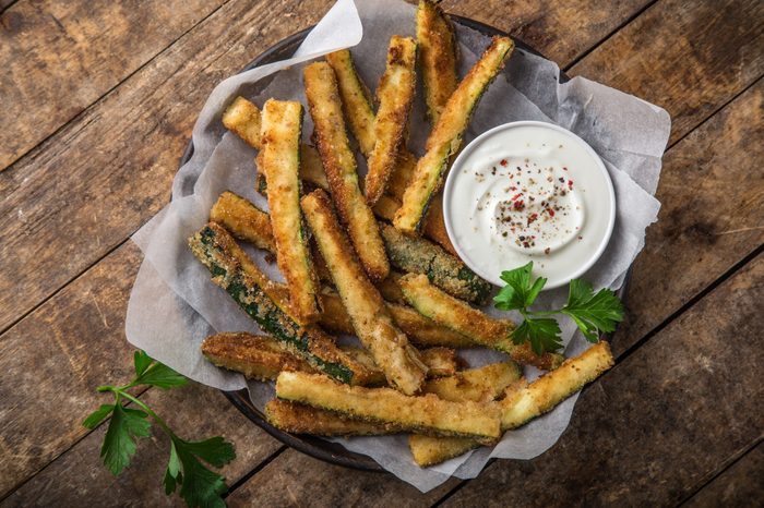 crispy zucchini fries with garlic yogurt sause. top view