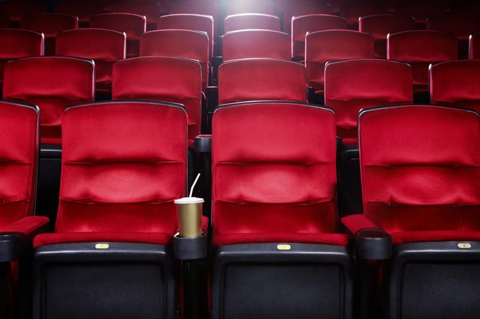 Empty movie theater with red seats
