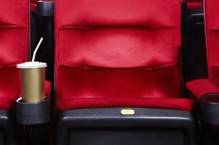 Empty movie theater with red seats