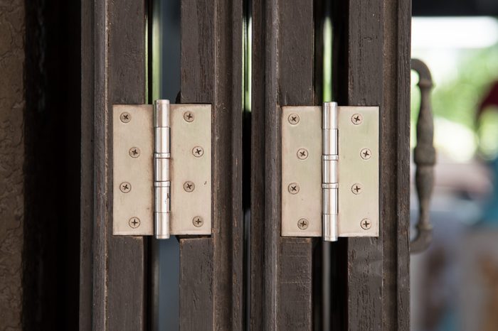 Close up of hing on the old wooden door