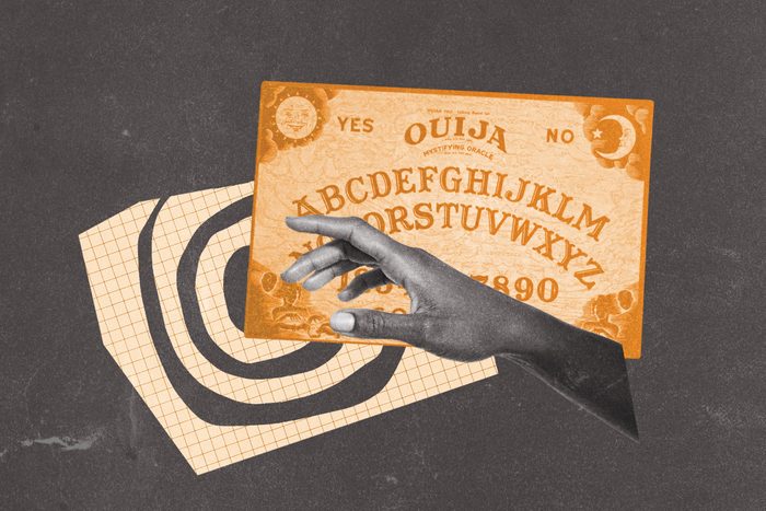 Ouija board collaged with swirl motif and outreached hand