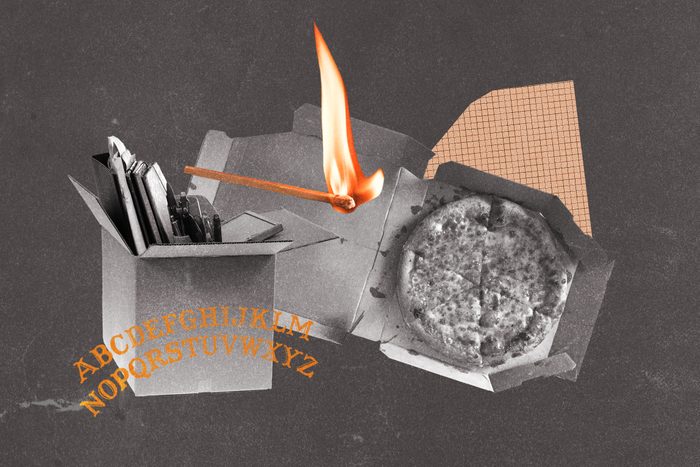 Ouija board letters collaged with moving box, lit match and pizza box