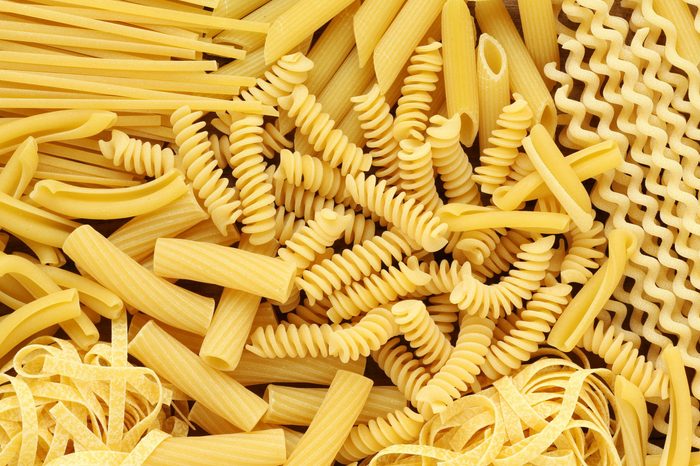 Variety of types and shapes of dry Italian pasta