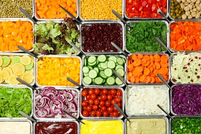 Top view of salad bar with assortment of ingredients