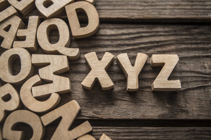 Vintage school desk with composition of wooden letters - Concept of studying and learning