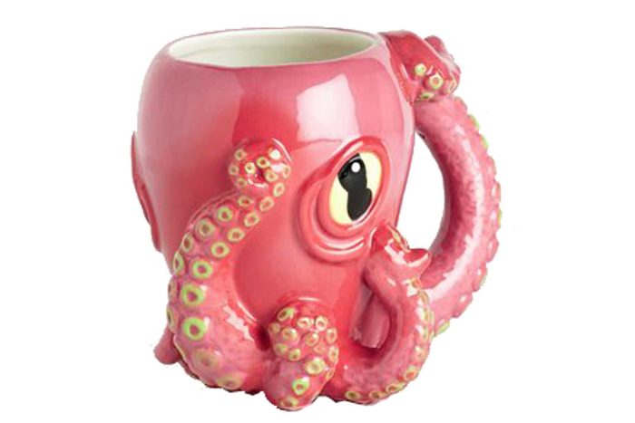 A pink octopus-shaped ceramic mug, showcasing tentacles as a handle, set against a plain white background.