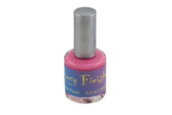 A pink nail polish bottle stands upright with a silver cap and purple label reading 