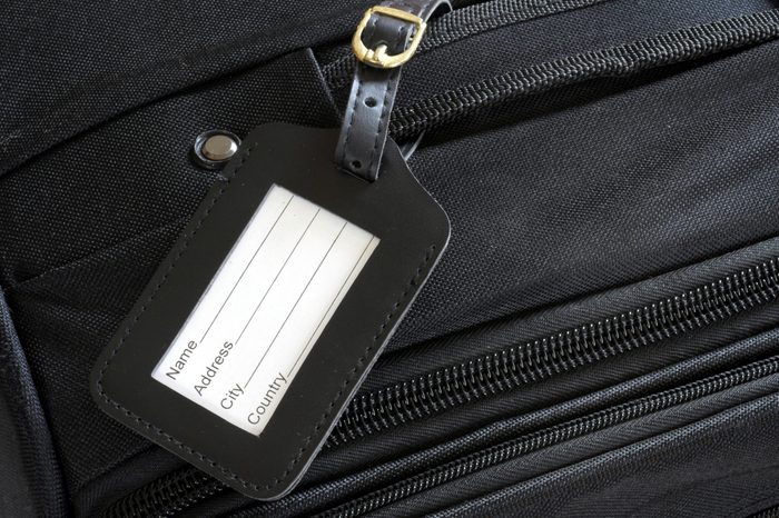 black leather label on a black suitcase