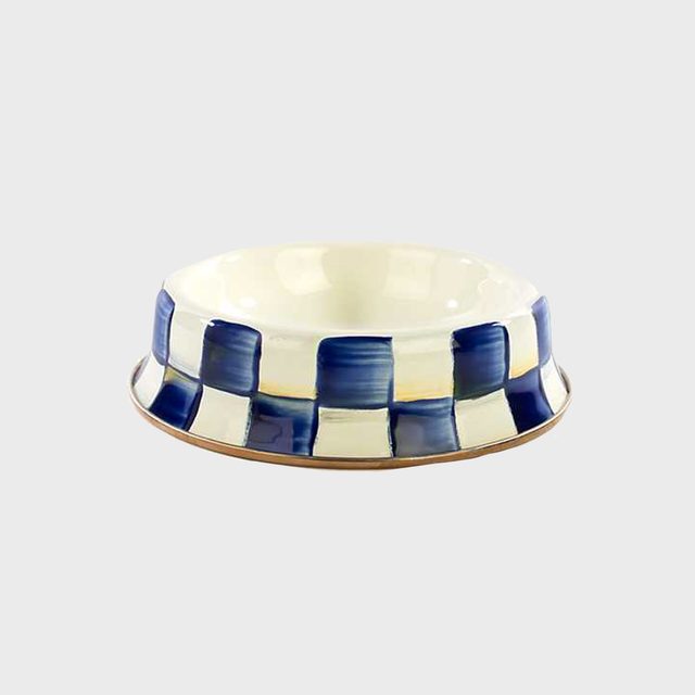 Blue and white checkered ceramic bowl sits on a plain gray background.