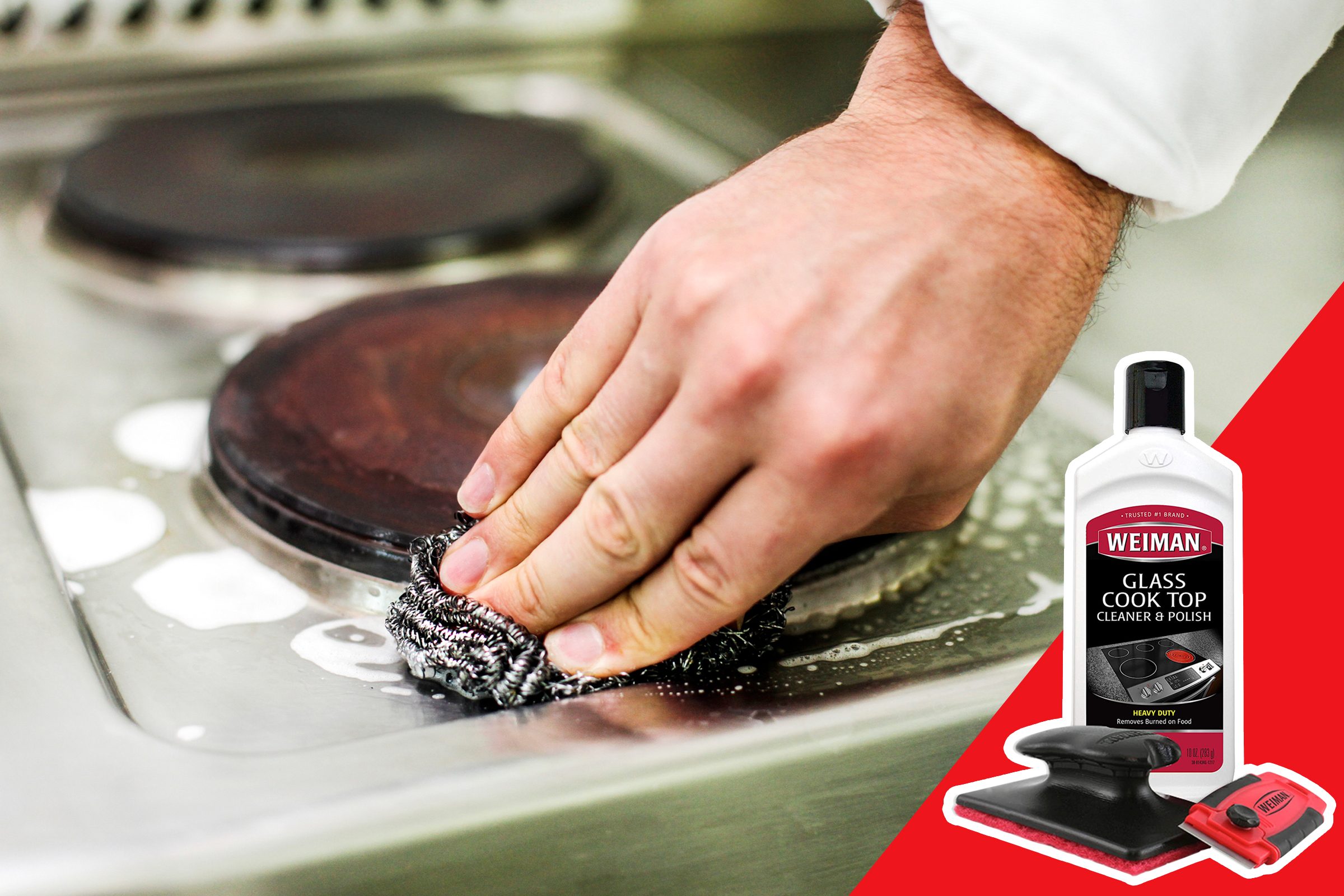 Hand scrubs stovetop with metal pad; Weiman cooktop cleaner, polish bottle, and tools are visible nearby.