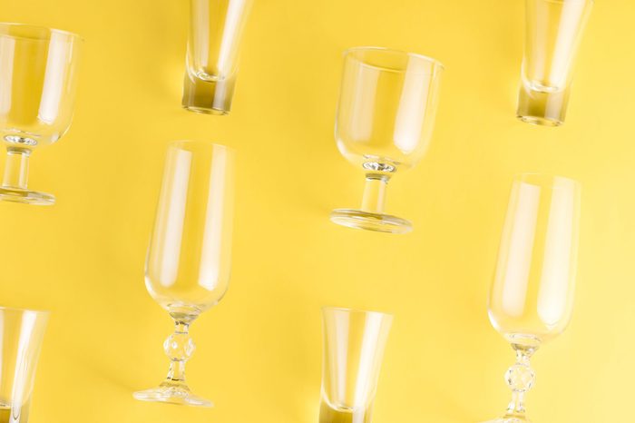 Collection of various glasses on bright background, copy space