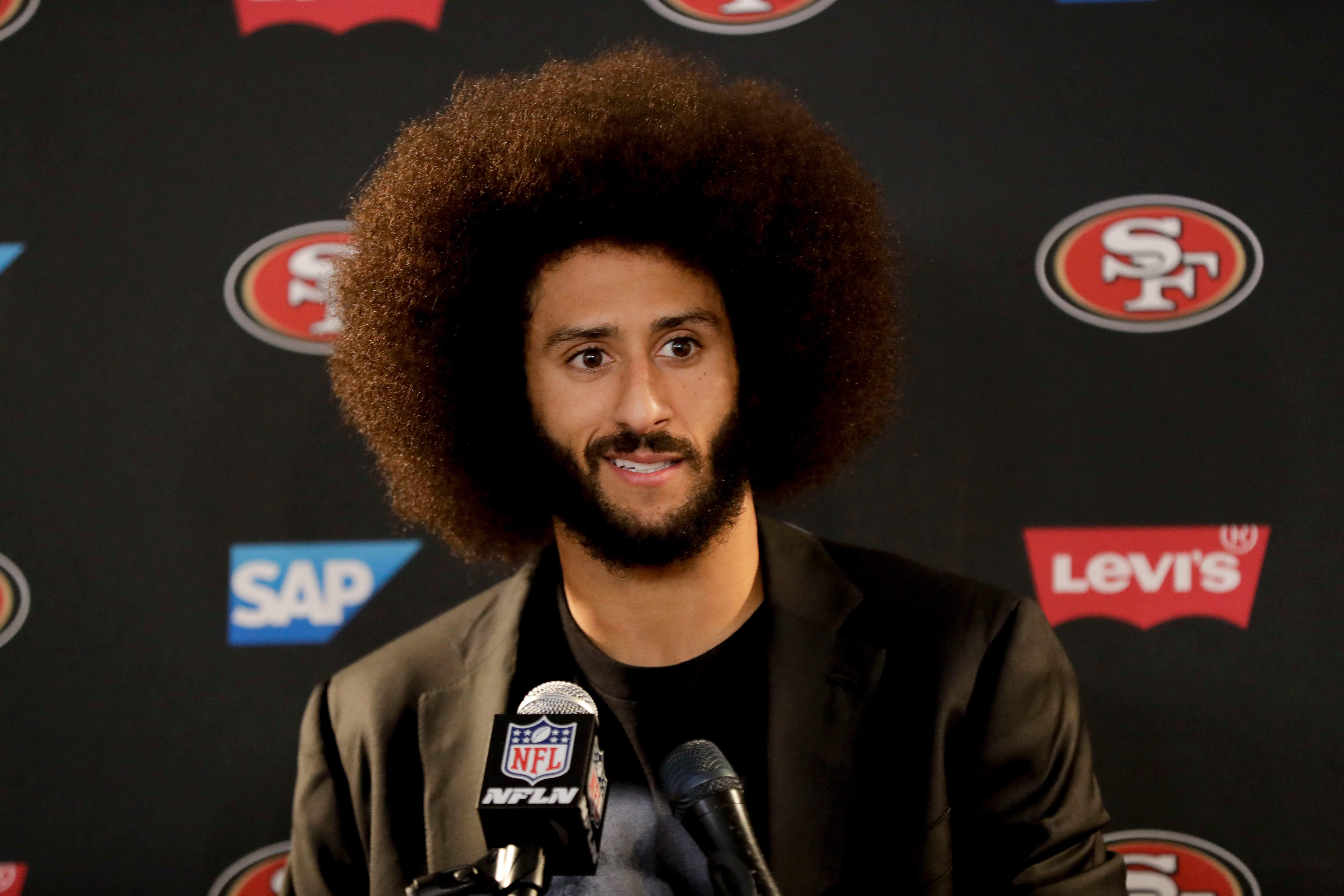 Mandatory Credit: Photo by AP/Shutterstock (9137518a) This Dec. 24, 2016 photo shows San Francisco 49ers quarterback Colin Kaepernick talking during a news conference after an NFL football game against the Los Angeles Rams. Kaepernick filed a grievance against the NFL on alleging that he remains unsigned as a result of collusion by owners following his protests during the national anthem Kaepernick-Grievance Football, Los Angeles, USA - 25 Dec 2016