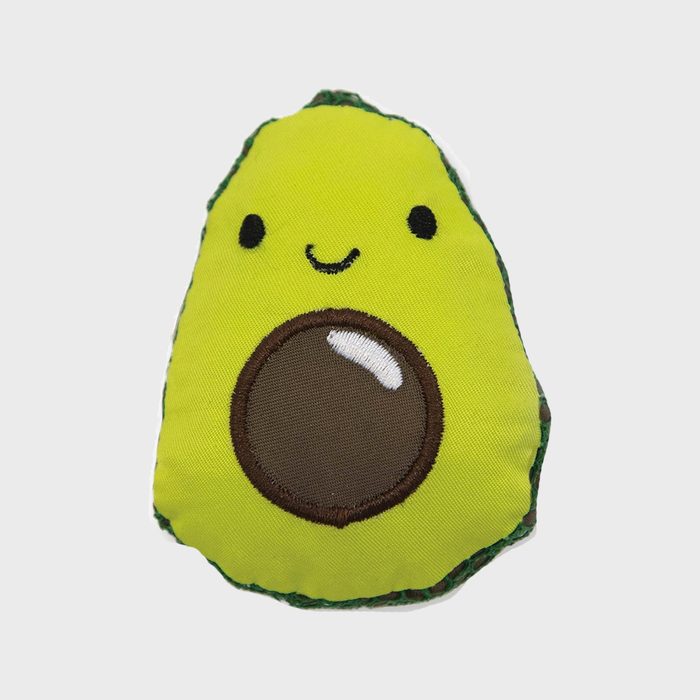 Plush avocado displays a smiling face and seed, sitting against a plain white background.