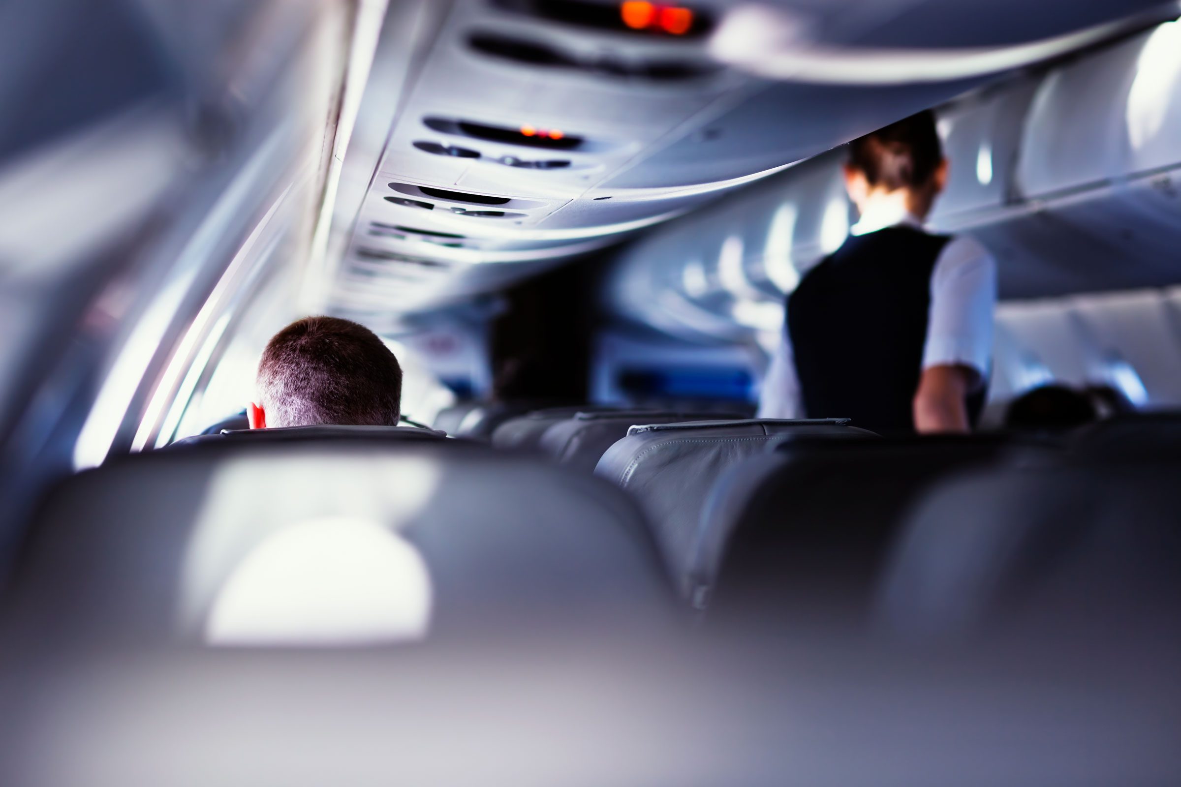 anonymous people from behind in an airplane