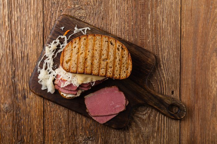 Ruben sandwich. New York sandwich with pastrami, sauce 1000 islands and sauerkraut. Top view. Fast food.