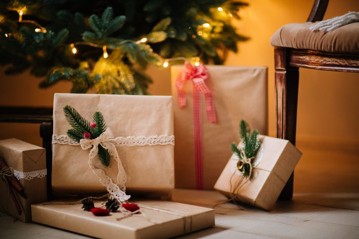 beautiful Christmas gifts under tree in new year decorated house interior